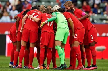 Canadian Women’s Soccer Team Forced To Play Under Threat Of Legal Action Canada Women's National Soccer Team in a team huddle
