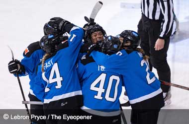 Toronto teammates celebrate Natalie Spooner scoring against Boston in PWHl game, March 2024