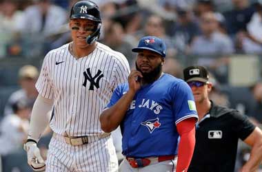 Aaron Judge and Vladimir Guerrero Jr.  in discussion during 2025 MLB Season