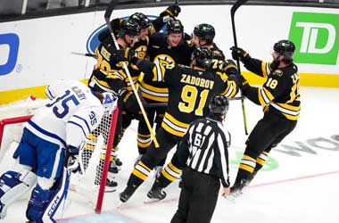 David Pastrnak celebrates scoring his 400th career goal with teammates during 2025 NHL Season