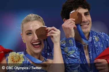 Piper Gilles and Paul Poirier celebrate winning bronze in Figure Skating Ice Dance at the 2026 Olympic Winter Games