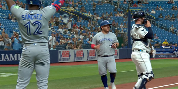 Alejandro Kirk gets cheered on by Jesús Sánchez in win against the Tampa Bay Rays during 2026 MLB season