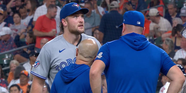 Trey Yesavage looks in discomfort as team trainers assess in defeat to Houston Astros during 2026 MLB season